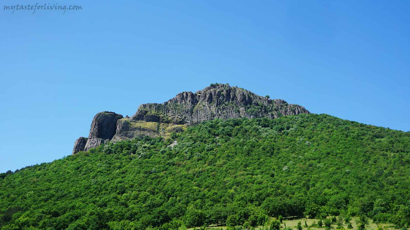 The medieval fortress and peak Monyak (Monek) are located about 11 km from the town of Kardzhali, Bulgaria, near the village of Shiroko Pole, above the dam Studen Kladenets. 