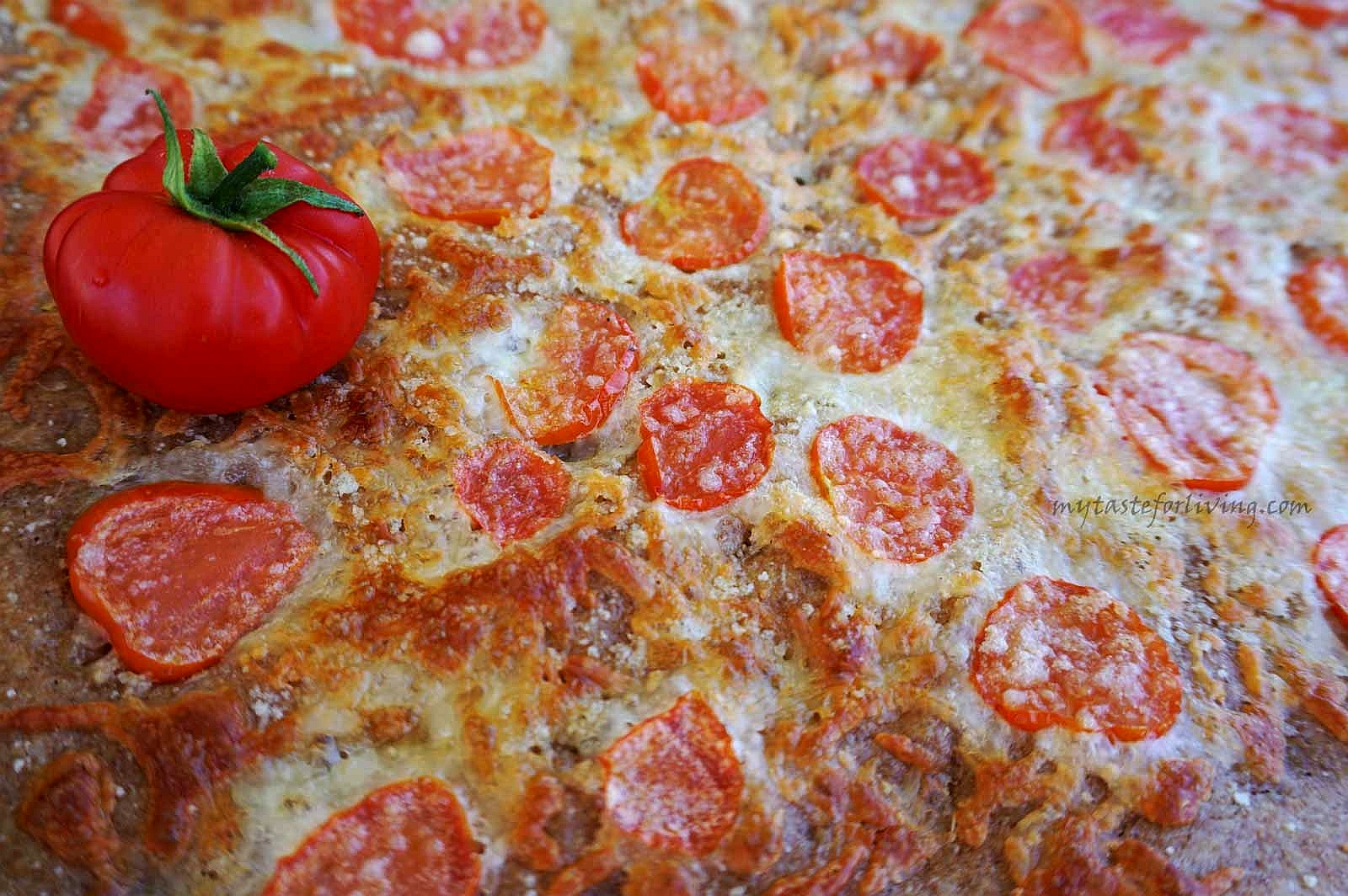 Easy and delicious whole wheat focaccia with tomatoes, mozzarella and parmesan.