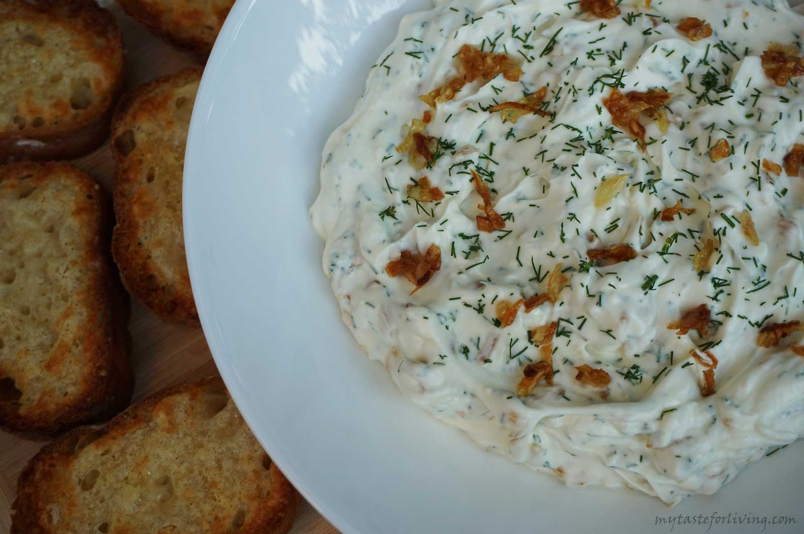 Delicious and appetizing dip of caramelized onions, sour cream, cream cheese, dill and garlic.