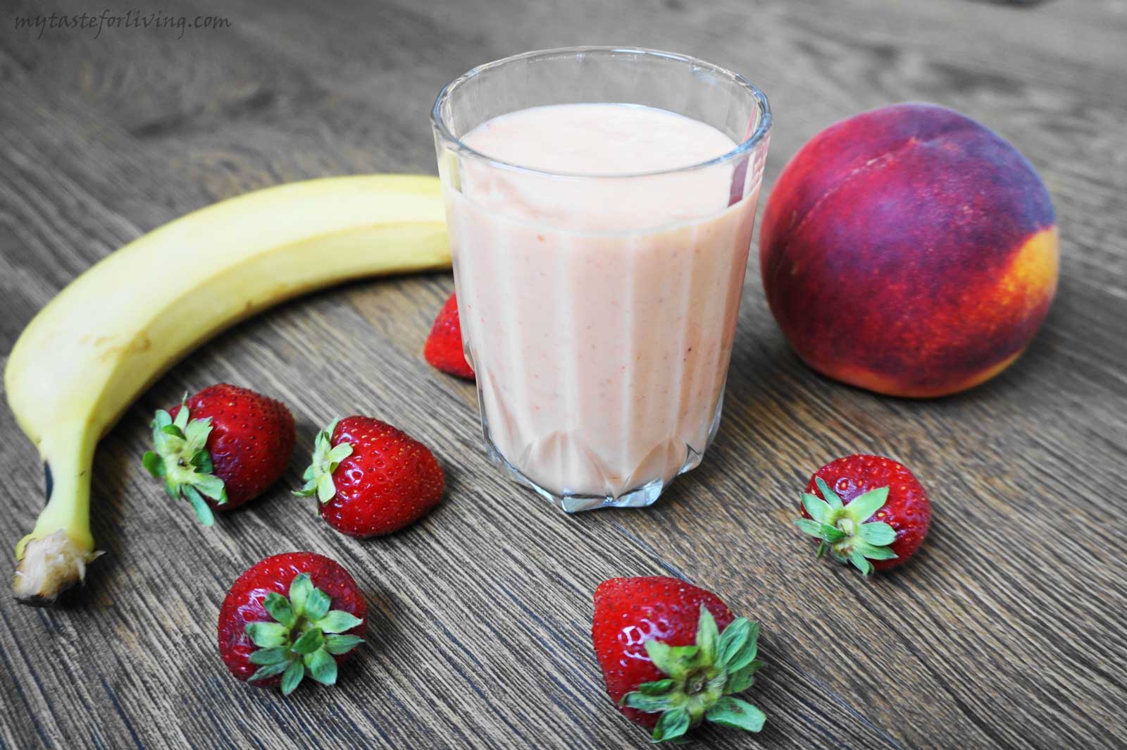 Delicious and fresh smoothie prepared with peach, banana, strawberries, honey, yogurt and coconut oil. 
