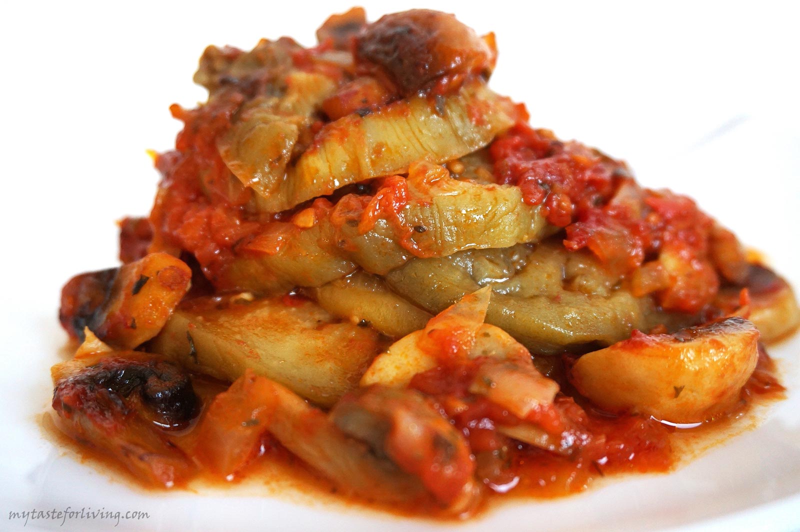 Favorite recipe for baked eggplant with homemade tomato sauce with onions, garlic and mushrooms. Suitable for vegans.