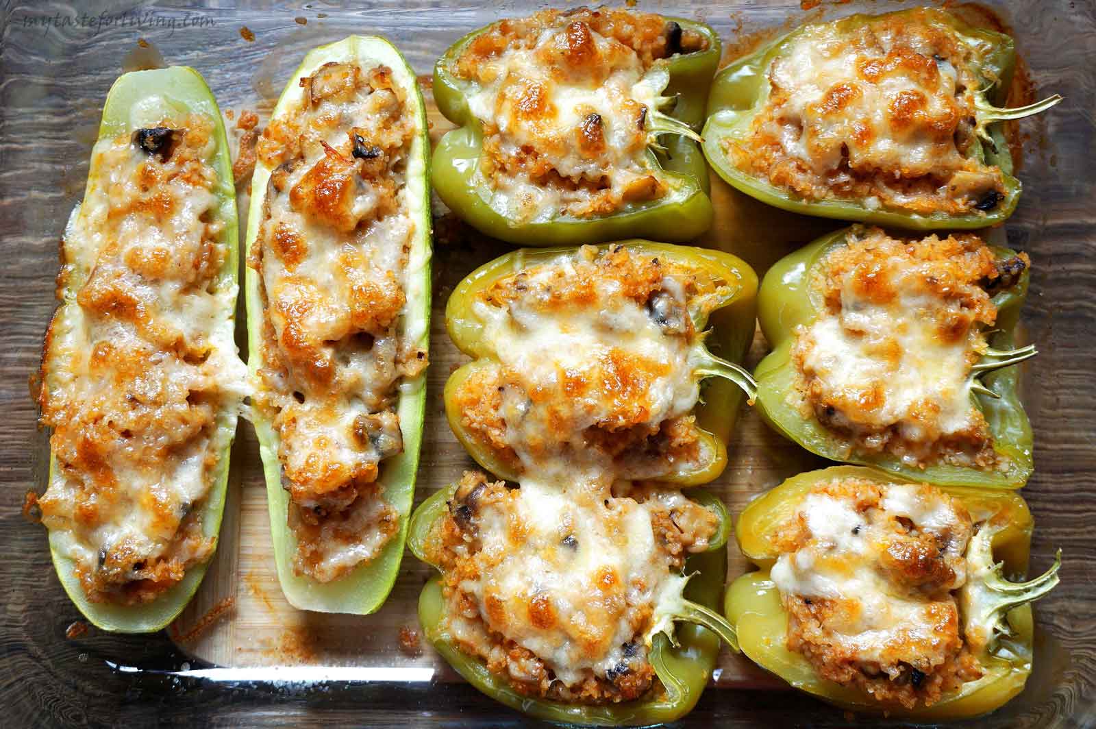 Delicious stuffed zucchini and peppers baked in the oven with bulgur, mushrooms, onions and tomatoes.