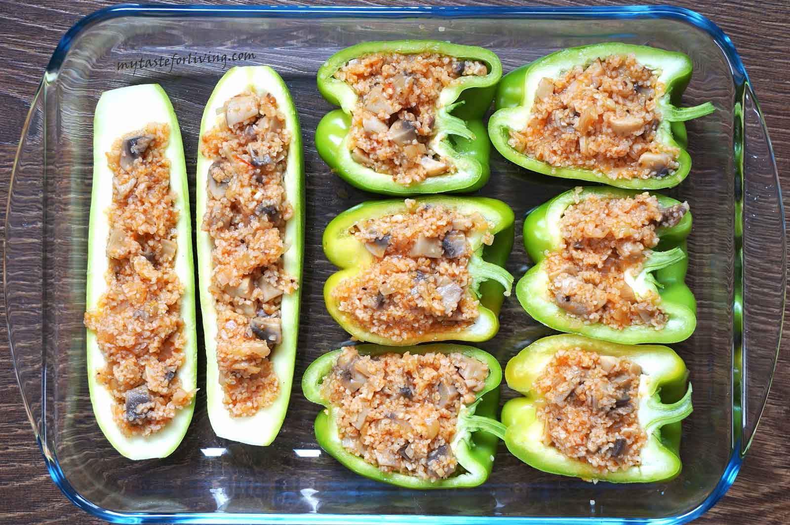Delicious stuffed zucchini and peppers baked in the oven with bulgur, mushrooms, onions and tomatoes.