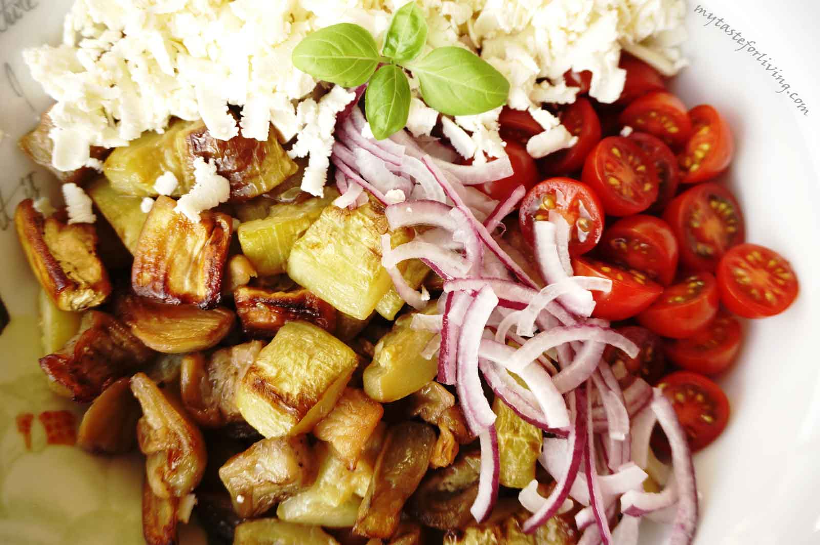 Roasted zucchini and eggplant salad with cherry tomatoes, red onion and feta cheese.