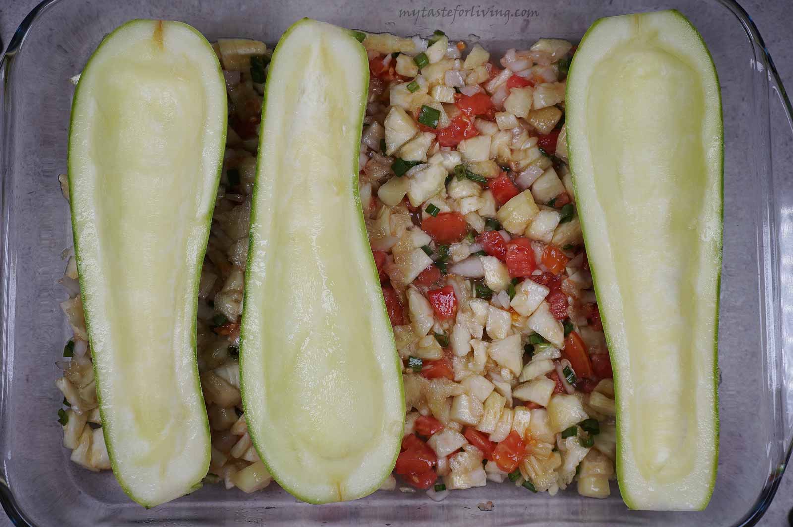 Stuffed zucchini (or boats) with feta cheese and tomatoes, baked in the oven or in short - one of my favourite summer dishes. I love that this recipe also uses the insides of the zucchini, resulting in a very tasty and light dish.